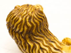 Detailed lion sculpture showcasing majestic mane and elegant craftsmanship for striking decor.
