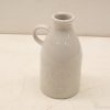 Charming white ceramic jug, ideal for decor or everyday use in any setting.