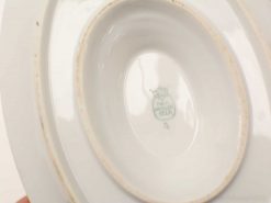 Elegant oval porcelain dish by Fabulous Peters, showcasing classic charm and subtle history.