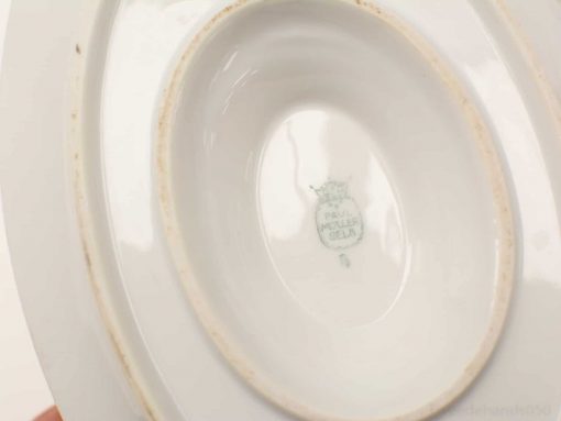 Elegant oval porcelain dish by Fabulous Peters, showcasing classic charm and subtle history.