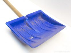 Durable blue snow shovel with wooden handle, perfect for efficient snow removal during winter.