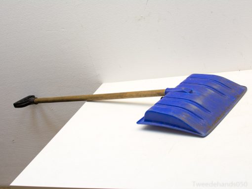 Ergonomic blue snow shovel with grip, perfect for efficient winter snow removal tasks.