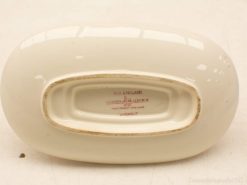 Elegant Old England porcelain bowl with glossy cream finish and classic oval shape.