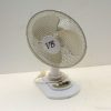 Retro table fan with elegant design and functional controls, perfect for nostalgic home decor.