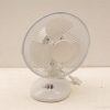 Elegant white desk fan for efficient cooling in small spaces, featuring adjustable airflow settings.