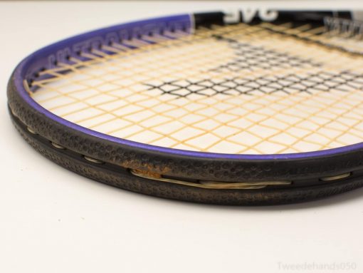 Vintage black and purple tennis racket showcasing wear, character, and a love for the game.