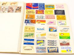 Colorful vintage matchbox labels showcasing unique designs and nostalgic branding from various eras.