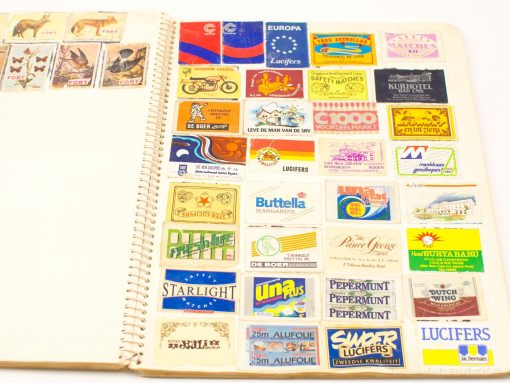 Colorful vintage matchbox labels showcasing unique designs and nostalgic branding from various eras.