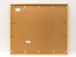 Back of an elegant wooden frame featuring secure clips and informative labels for collectors.