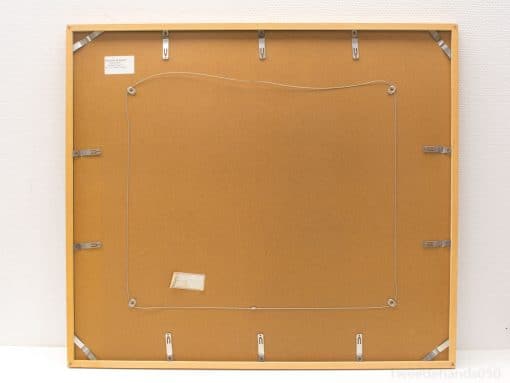 Back of an elegant wooden frame featuring secure clips and informative labels for collectors.