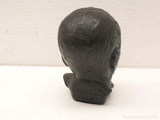 Handcrafted vintage head sculpture with unique hairstyle, ideal for collectors and art enthusiasts.