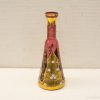 Elegant vintage pink and gold vase with floral patterns, perfect for luxurious home decor.