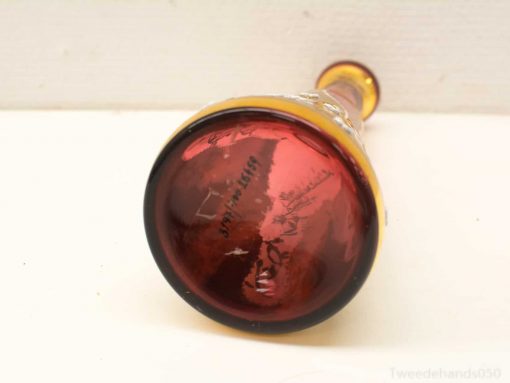 Elegant red and yellow glass vase showcasing exquisite craftsmanship and vibrant decorative design.