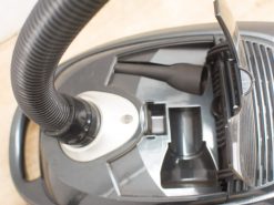 Sleek black Montiss vacuum 98656 with flexible hose and organized cleaning accessories for efficient cleaning.
