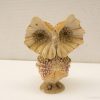 Charming seashell owl figurine, a creative vintage decor piece for nature enthusiasts.