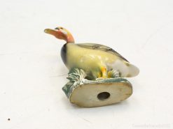 Charming vintage ceramic duck figurine with glossy finish, ideal for collectors and nature lovers.