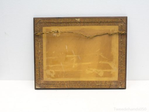 Vintage wooden frame with intricate details, ideal for showcasing cherished memories or artwork.