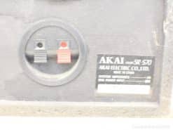 Vintage AKAI SR-570 close-up showcasing red and black audio terminals and authentic design.