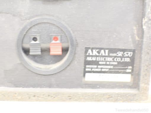 Vintage AKAI SR-570 close-up showcasing red and black audio terminals and authentic design.