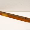 Elegant vintage wooden weaving shuttle, handcrafted for textile artistry and collectors decor.