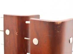 Stylish mahogany corner pieces with metal accents for elegant and functional interior decor.