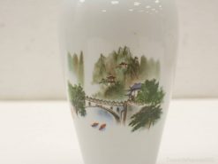 Elegant porcelain vase featuring serene landscape, bridge, and vibrant colors for refined decor.