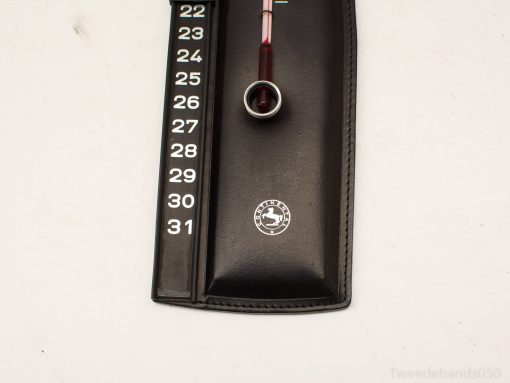 Vintage thermometer in black leather case with clear Celsius scale for accurate temperature measurement.