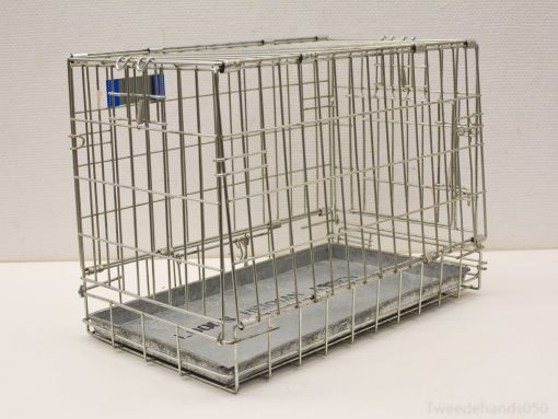 Modern metal wire crate for transporting small pets with secure latch and removable tray.