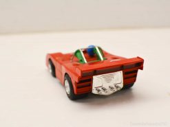 Vibrant red miniature race car for kids, offering fun play and stunning collectible appeal.
