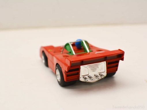 Vibrant red miniature race car for kids, offering fun play and stunning collectible appeal.