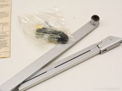 Geze door closer arm set with screws and manual for precise assembly and installation.