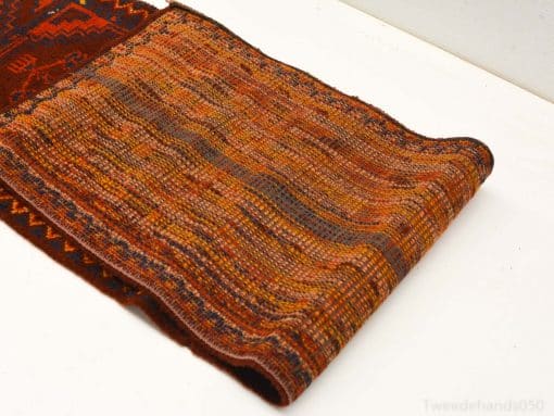 Elegant vintage Persian textile in warm earth tones with intricate geometric patterns.
