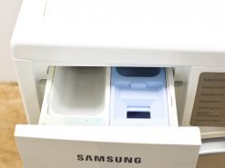 Samsung washing machine drawer featuring organized compartments for detergent and fabric softener usage.