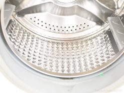 Polished Samsung 7kg washing machine drum with diamond pattern for efficient laundry cleaning.
