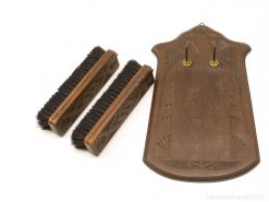 Elegant vintage cleaning tool set with carved holder, blending style and practicality for home decor.