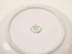 Elegant Alfred Meakin porcelain plate with crown emblem, showcasing refined craftsmanship and historical charm.