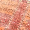 Vibrant geometric rug with intricate traditional patterns, showcasing exceptional craftsmanship and cultural heritage.