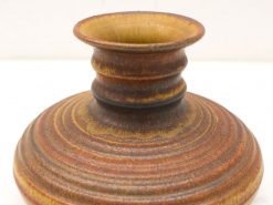 Elegant vintage pottery vase with unique textures and rich earthy colors, ideal for collectors.