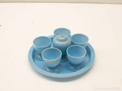 Charming blue ceramic cup set with tray and spice holder for delightful gatherings.