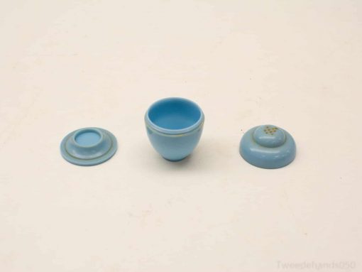 Elegant blue ceramic bowl with domed lid and sturdy base, perfect for decoration or storage.