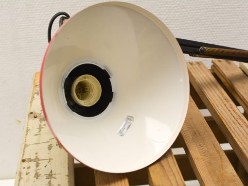 Stylish red and white vintage desk lamp with adjustable arm, perfect for retro home decor.