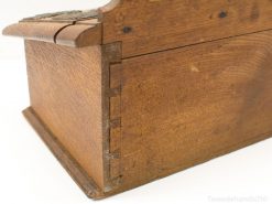 Antique wooden box with dovetail joints, combining elegance and functionality for treasured storage.