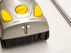 Sleek 1800W silver and yellow vacuum cleaner with adjustable suction and easy-glide wheels.
