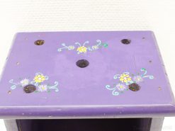 Vintage purple wooden box with floral design, perfect for storage or decorative use.