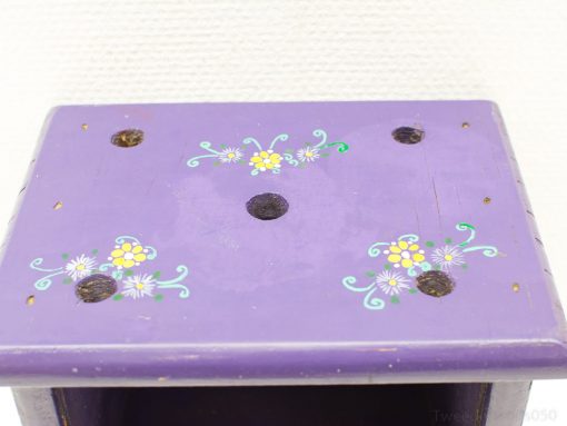 Vintage purple wooden box with floral design, perfect for storage or decorative use.