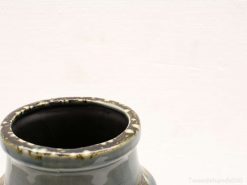Elegant handmade gray ceramic vase with a glossy finish and unique flared rim detail.