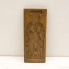 Traditional wooden carving featuring intricate designs, perfect for decoration or ceremonial use.
