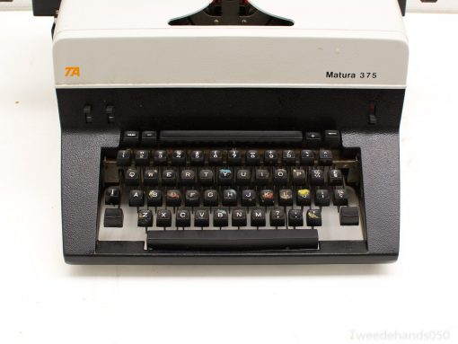 Vintage Matura 375 typewriter in black and gray, showcasing classic design and functionality.