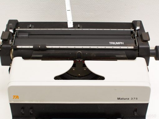 Classic Triumph Matura 375 typewriter showcasing retro design and tactile QWERTY keys.