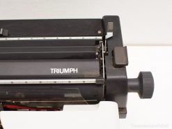 Vintage Triumph typewriter: classic charm, polished black finish, ideal for collectors and writers.